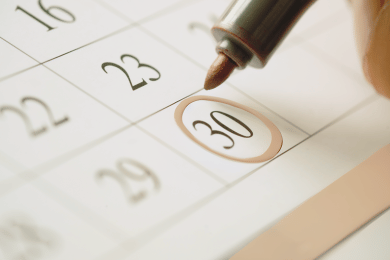 a person circling a date to make sure a trim installation project is done on time.