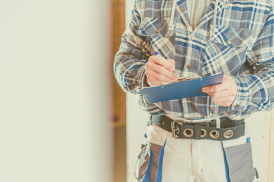 A person taking detailed notes for an upcoming trim installation